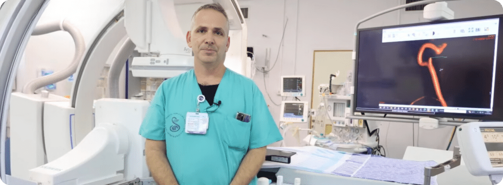Dr. Gal Yaniv standing in an AIDOC supported operating theater. Sheba Healthcare Center.